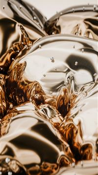 a pile of shiny metal objects sitting on top of a ... wallpaper