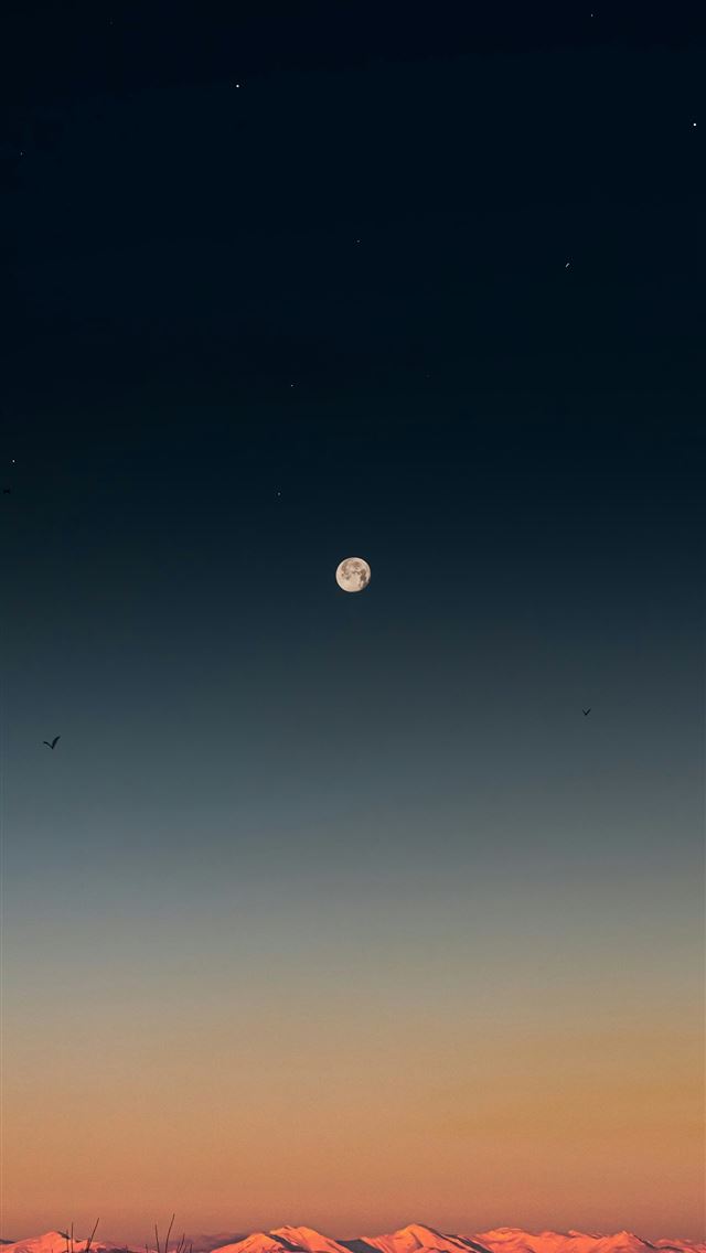 1290x2796 a full moon is seen in the sky above a mountain ra... - stars iPhone Wallpaper