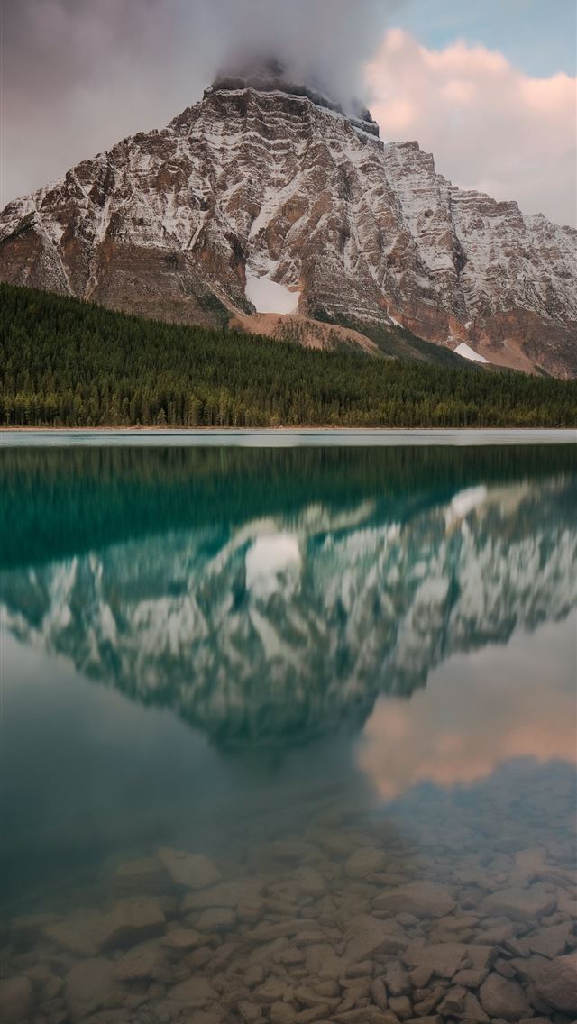 1290x2796 lake near mountain under white sky during daytime -  iPhone Wallpaper