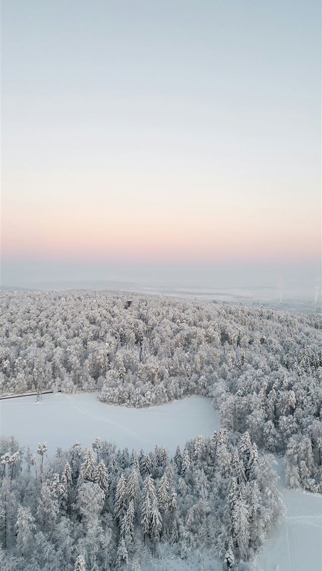 640x1136 an aerial view of snow covered trees and a lake -  iPhone Wallpaper