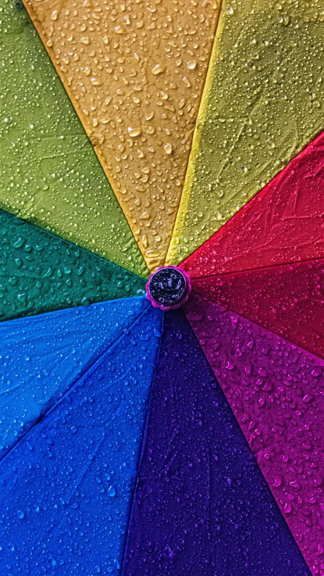 1290x2796 a multicolored umbrella with drops of water on it -  iPhone Wallpaper