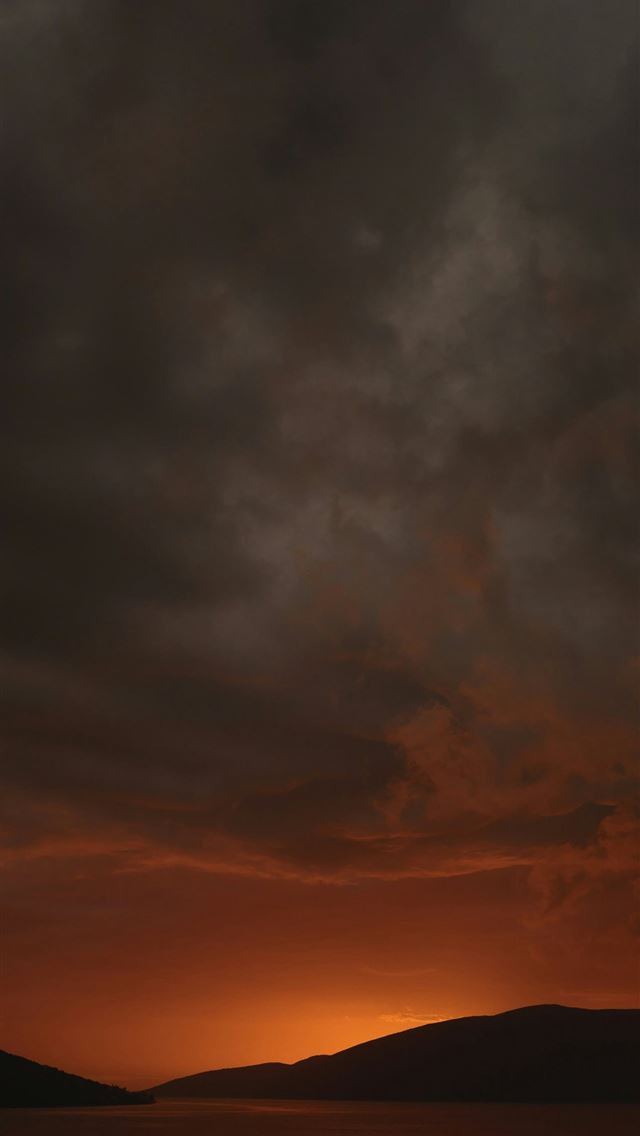 1290x2796 the sun is setting over a body of water -  iPhone Wallpaper