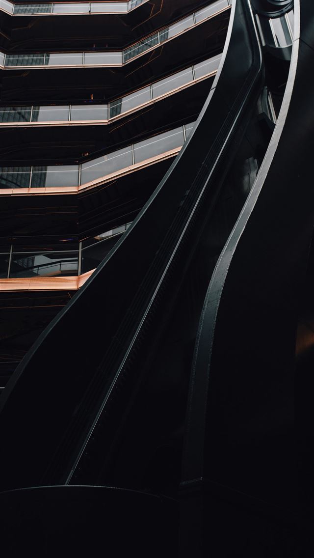 1290x2796 a tall building with a spiral staircase going up i... -  iPhone Wallpaper