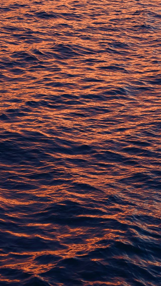1290x2796 a large body of water with a boat in the distance - horizon iPhone Wallpaper