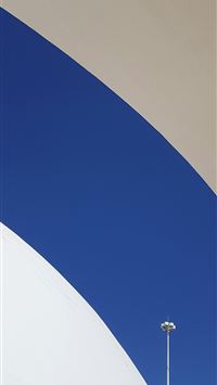 a white and blue building with a street light wallpaper
