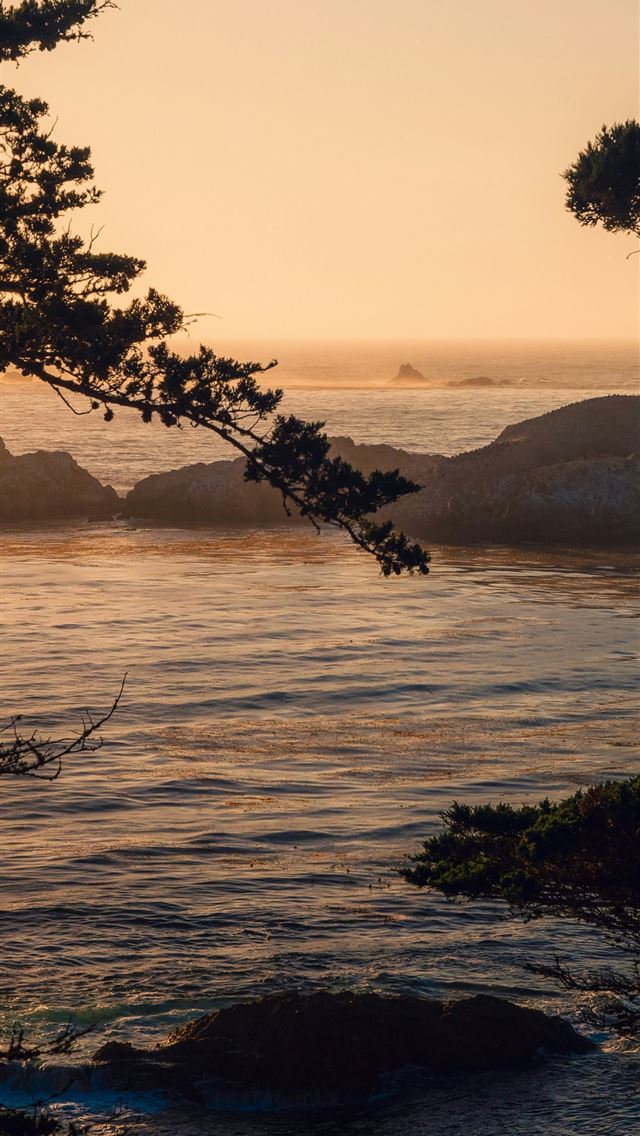 1290x2796 a view of a body of water at sunset - beach iPhone Wallpaper