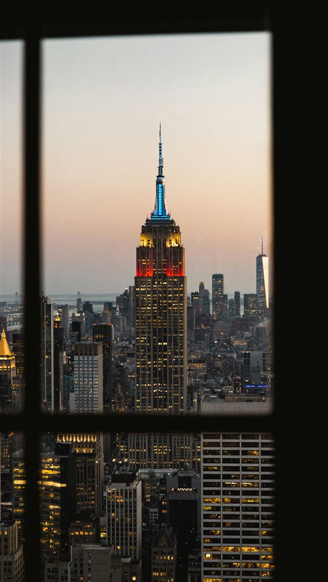 1290x2796 a view of the empire building from a window -  iPhone Wallpaper