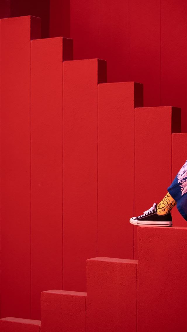 1290x2796 a person is sitting on a stair case - minimal iPhone Wallpaper