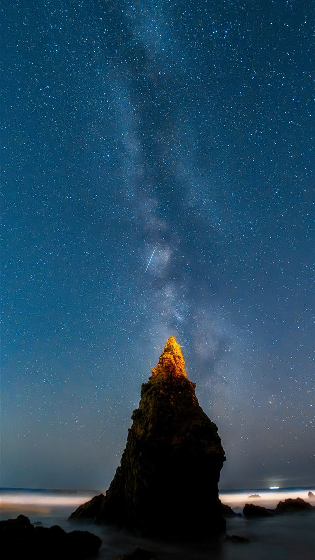 1290x2796 the night sky with stars above a rocky outcropping -  iPhone Wallpaper