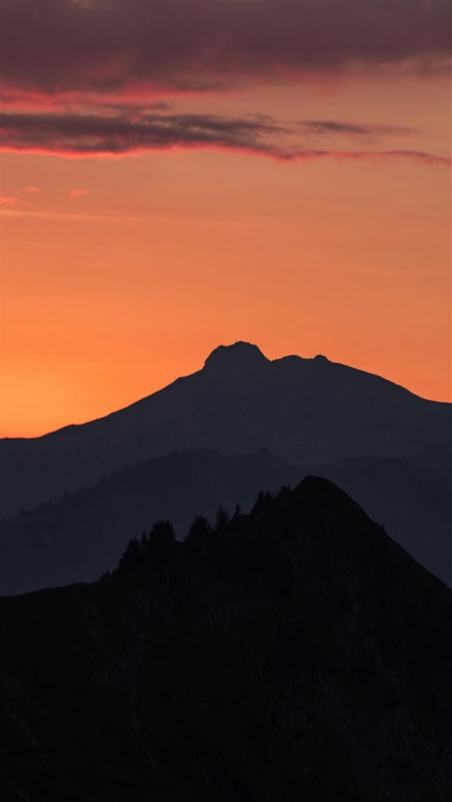 1290x2796 the sun is setting over a mountain range - mountains iPhone Wallpaper