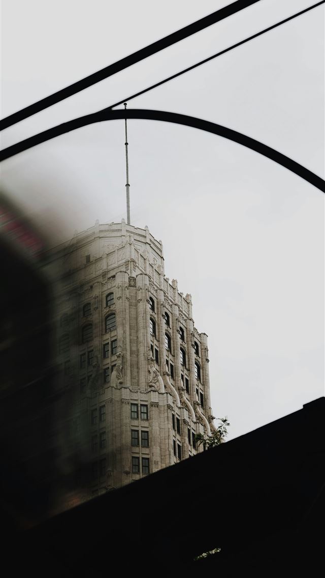 1290x2796 a view of a building from a train window -  iPhone Wallpaper