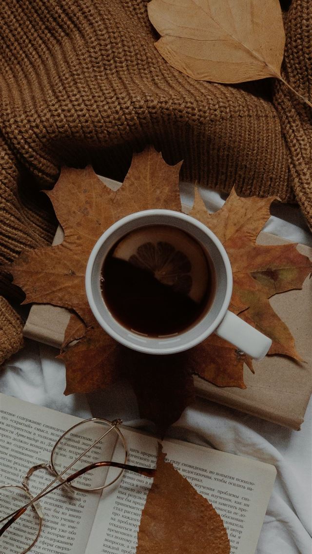 1290x2796 a cup of coffee and a book on a bed -  iPhone Wallpaper