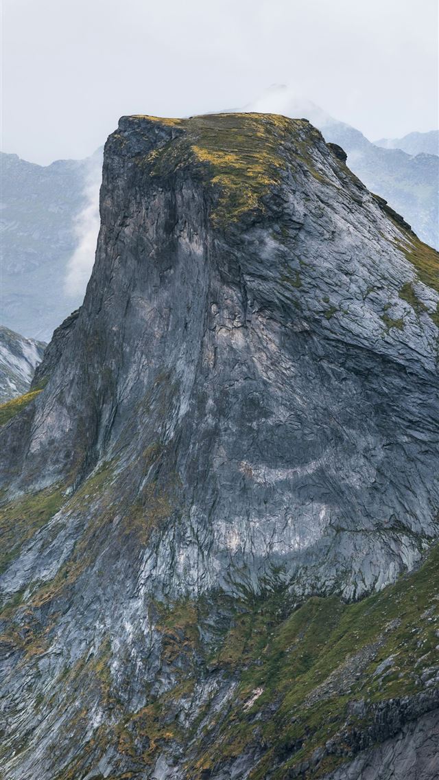1290x2796 a large mountain with a very tall rock on top of i... - outdoors iPhone Wallpaper