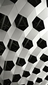 a black and white photo of a geometric structure wallpaper