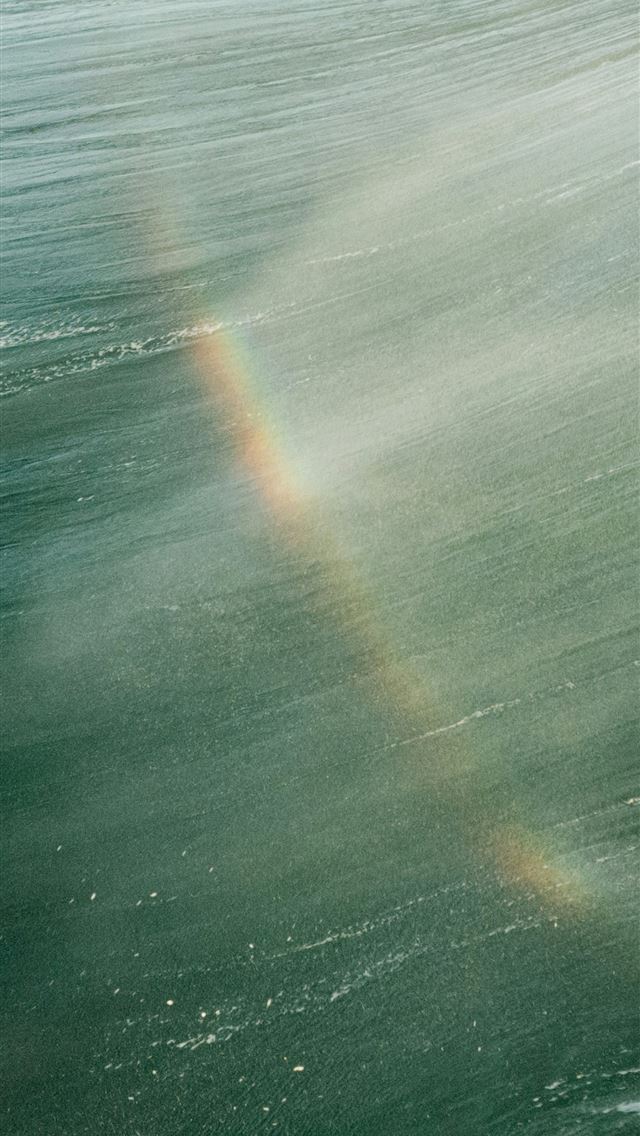 1290x2796 Rainbow appears on a breaking ocean wave - sea iPhone Wallpaper
