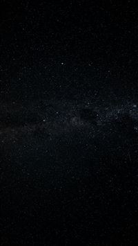 A vast starry night sky with the milky way visible... wallpaper