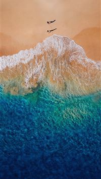Aerial view of a beach with people  wallpaper