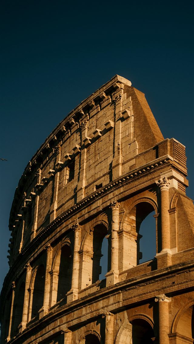 1290x2796 The ancient colosseum under a clear blue sky  -  iPhone Wallpaper