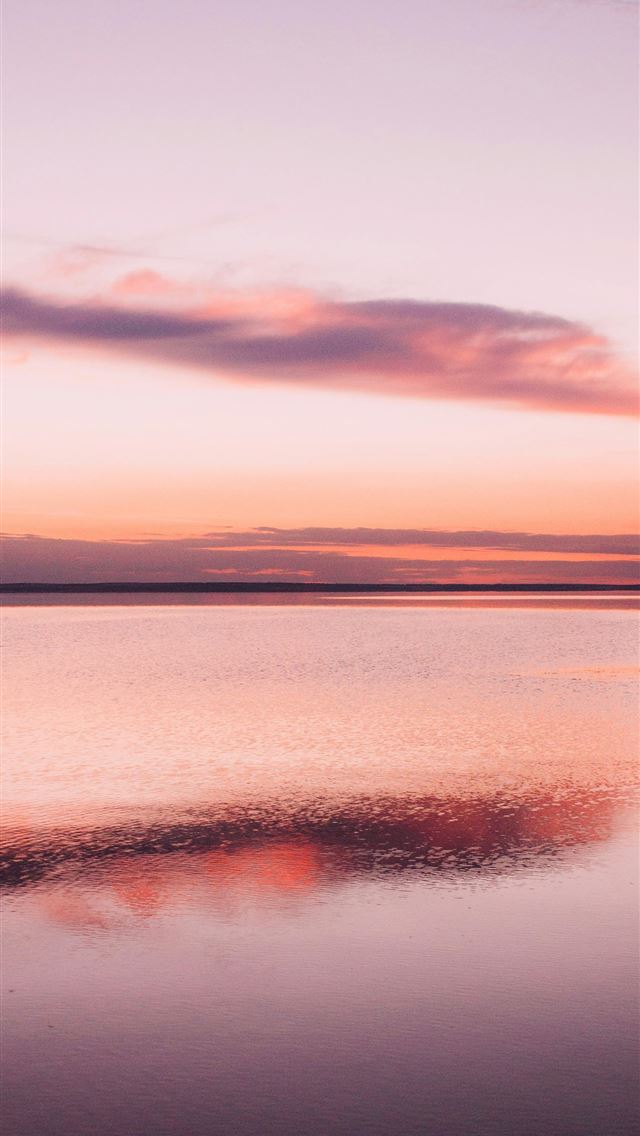 1290x2796 Calm water reflects a pastel sunset sky with cloud... - spring iPhone Wallpaper