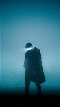 silhouette of man standing on the ground wallpaper