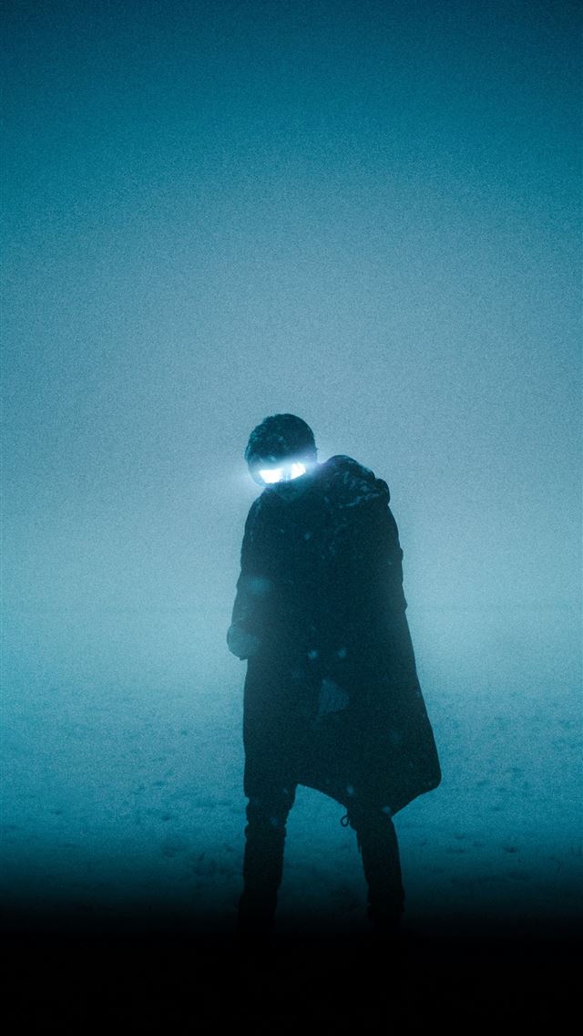 1290x2796 silhouette of man standing on the ground - winter iPhone Wallpaper