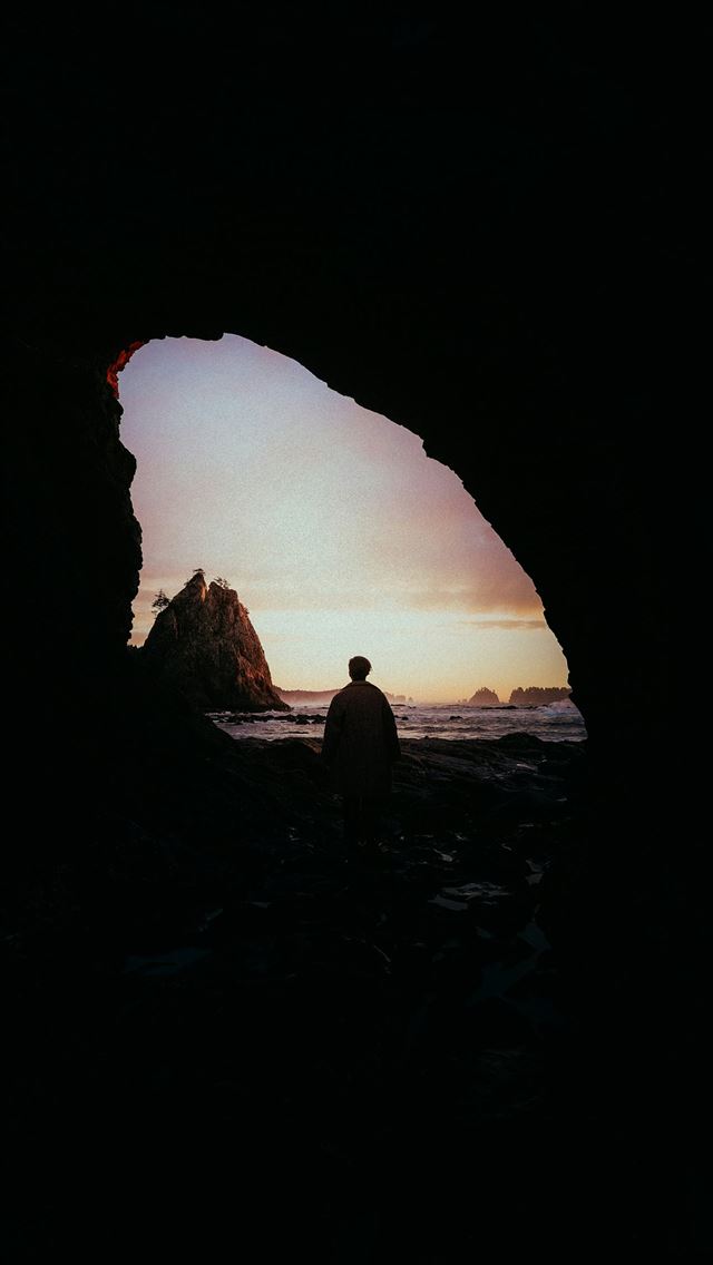 1290x2796 Silhouette of person looking at sunset from cave o... -  iphone 13 Wallpaper