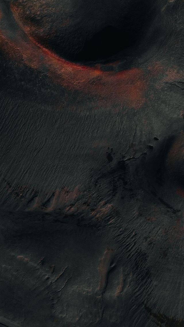 1290x2796 A close up of a black object with red spots - lake iPhone Wallpaper