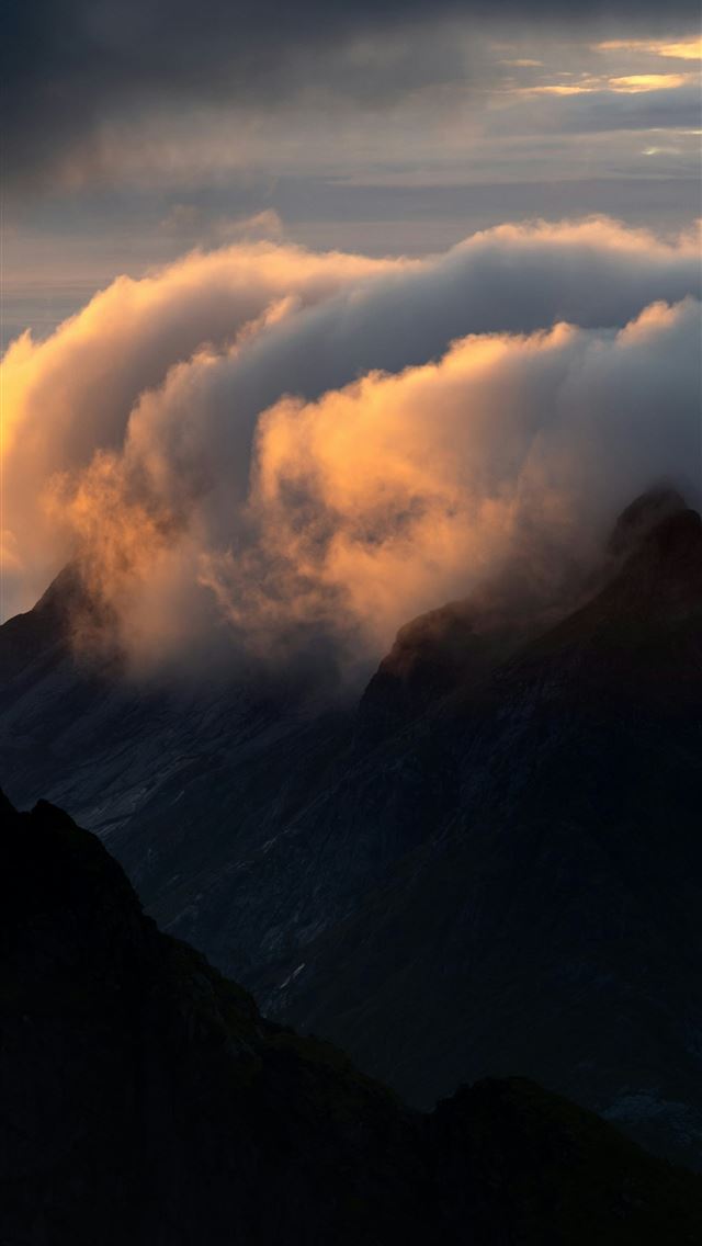 1290x2796 Clouds glowing with golden light clinging to dark ... -  iPhone Wallpaper