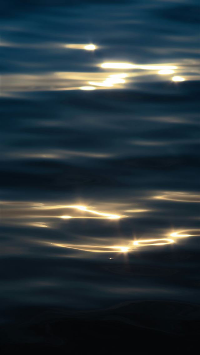 1290x2796 Sunlight glinting on dark rippling water - light iPhone Wallpaper