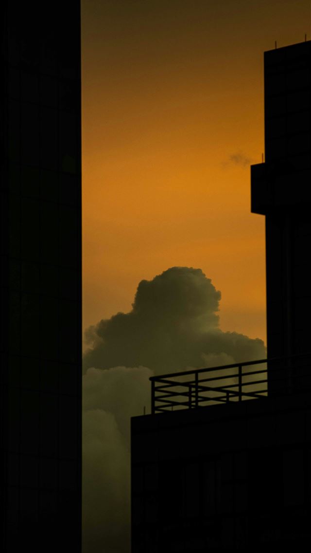 1290x2796 silhouette of buildings under gray skies -  iPhone Wallpaper