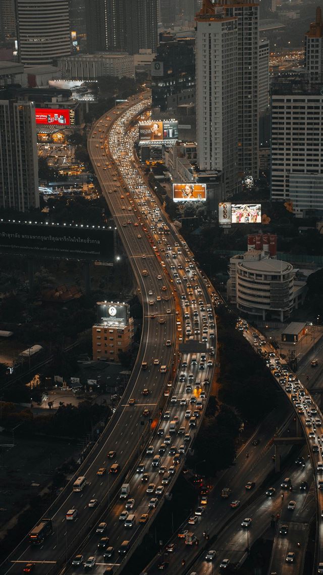 1290x2796 Busy city highways with heavy traffic at dusk -  iphone 13 Wallpaper