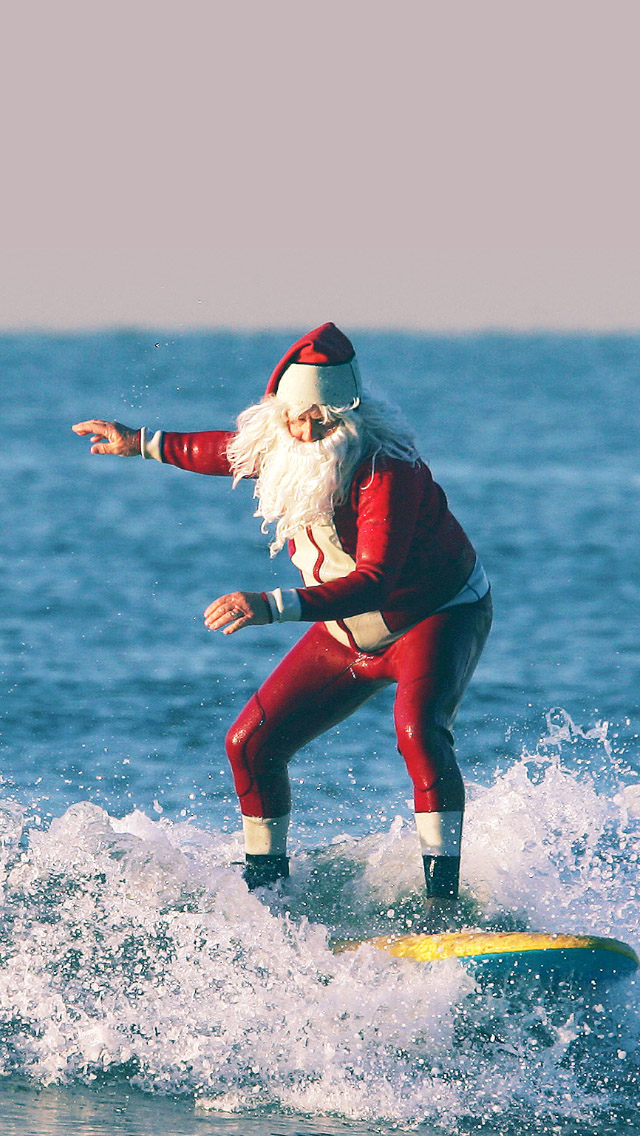 Surfing Santa Claus iPhone wallpaper 