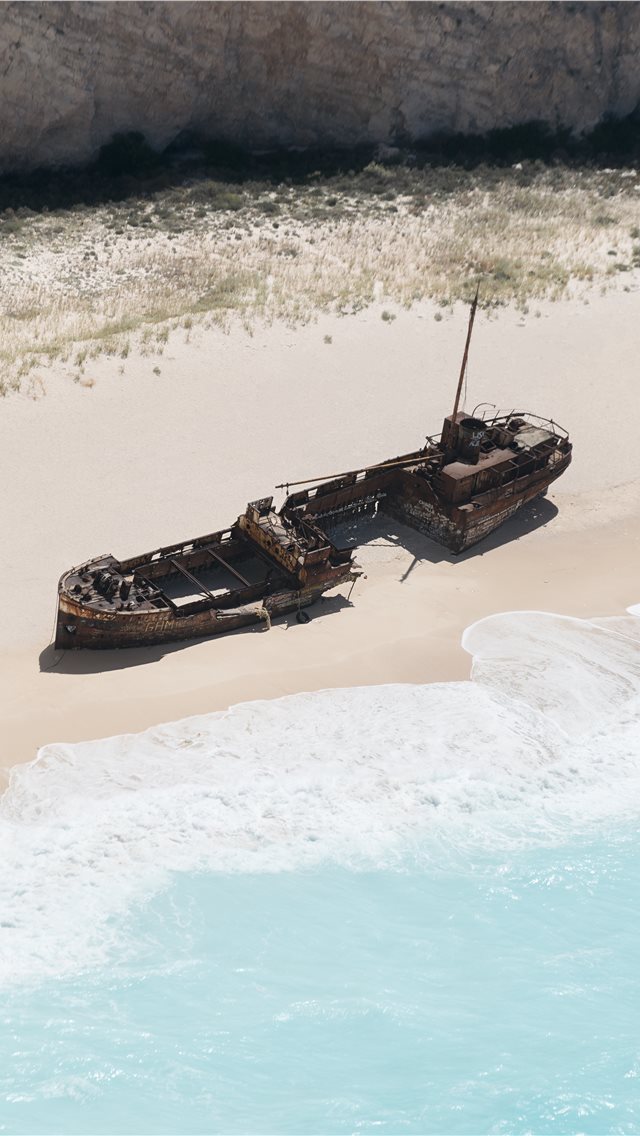 640x1136 wrecked brown ship on seashore - transportation iPhone Wallpaper