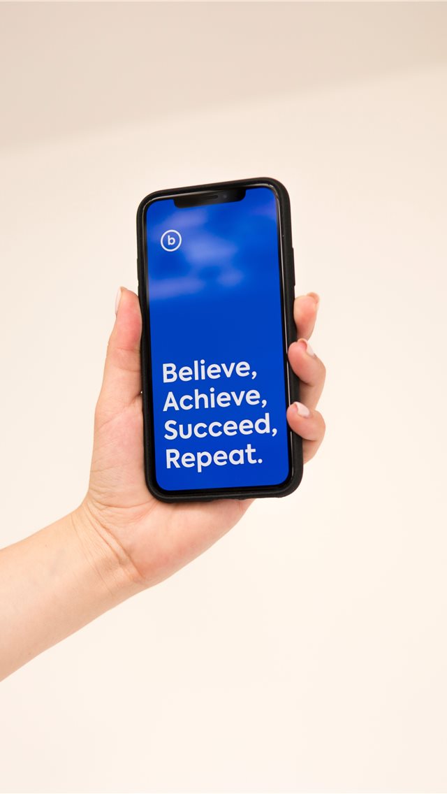 hand holding iphone x with cool quote iPhone wallpaper 