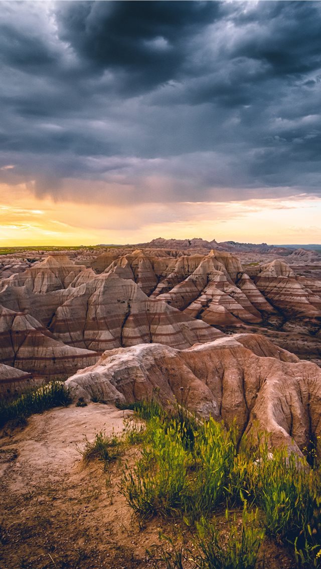 640x1136 A morning storm in the Badlands being chased away ... - mesa iPhone Wallpaper