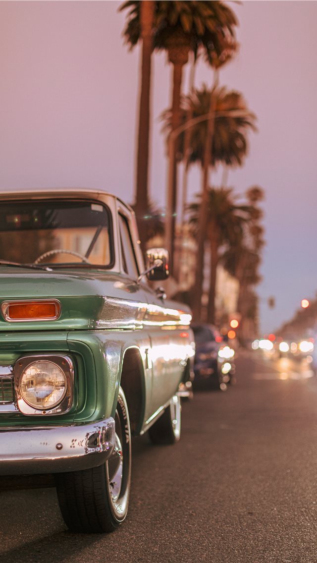 640x1136 Vintage car parked on Ocean Blvd during sunset  - machine iPhone Wallpaper