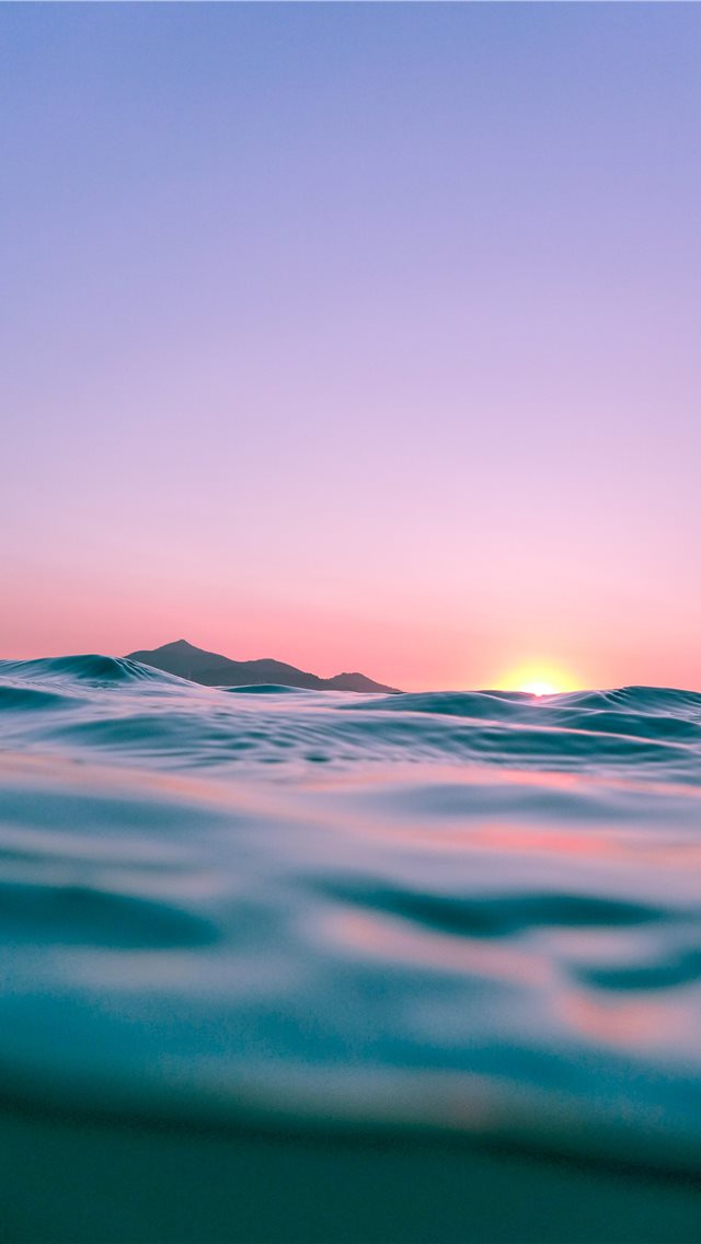 calm body of water during golden hour iPhone wallpaper 
