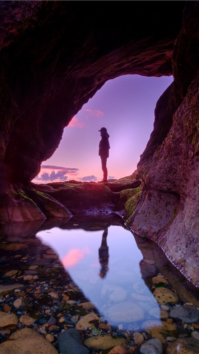 640x1136 man standing in front of cave -  iPhone Wallpaper
