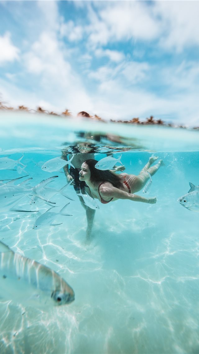 640x1136 two people diving on clear body of water -  iPhone Wallpaper
