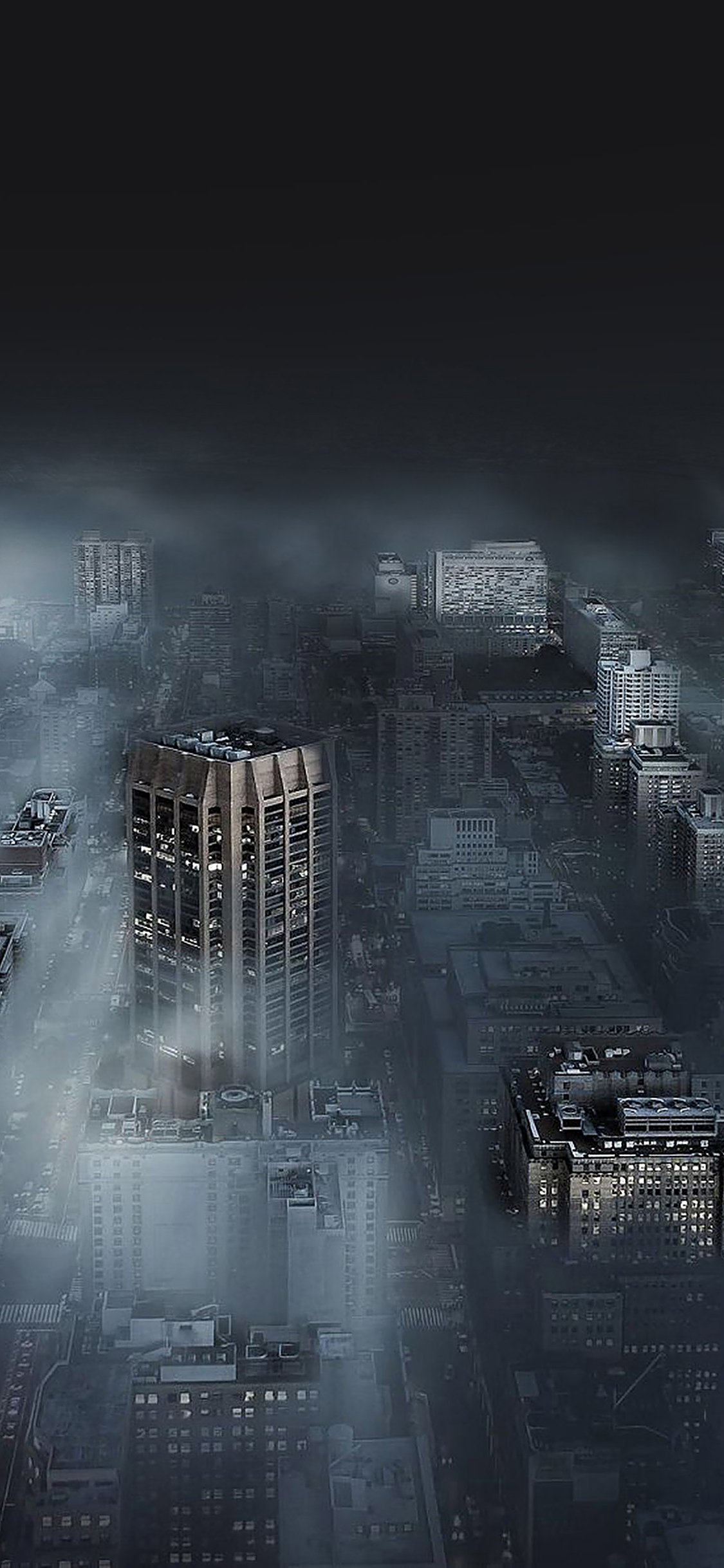 Dark city in fog iPhone wallpaper 
