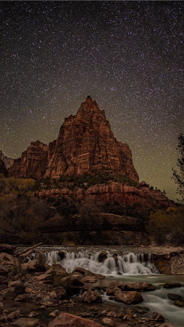 timelapse photography of river overlooking rock mo... iPhone wallpaper 