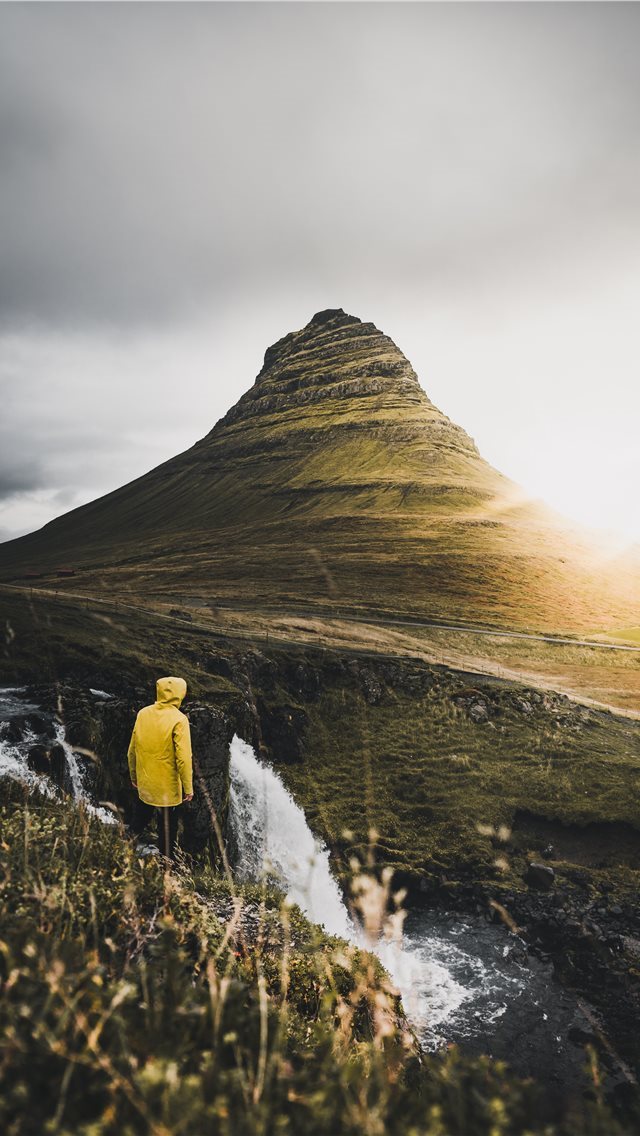640x1136 person standing on cliff near waterfalls during da... - iceland iPhone Wallpaper