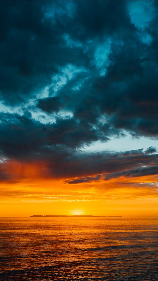 640x1136 green and black clouds partly covering orange sky ... - united states iPhone Wallpaper