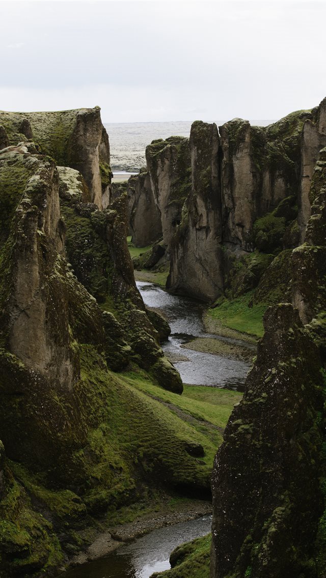 640x1136 river in deep gorge between rock faced hills - scenery iPhone Wallpaper