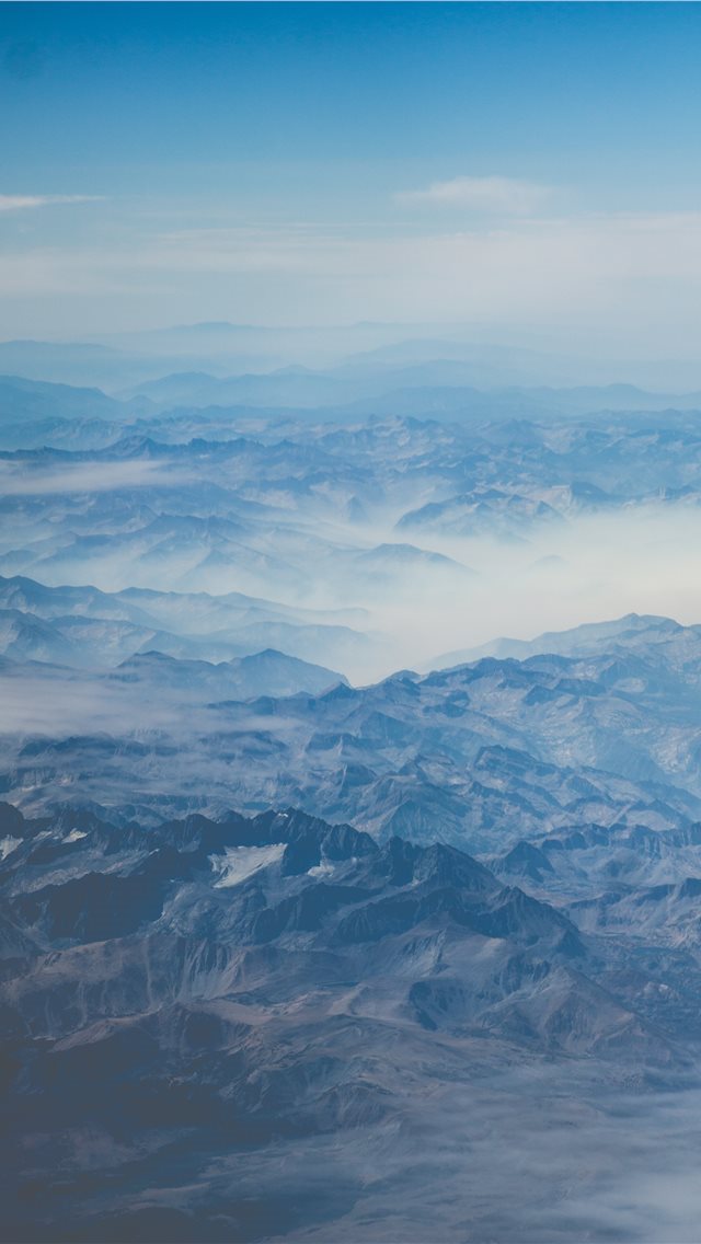 640x1136 mountain under blue sky at daytime - clouds iPhone Wallpaper
