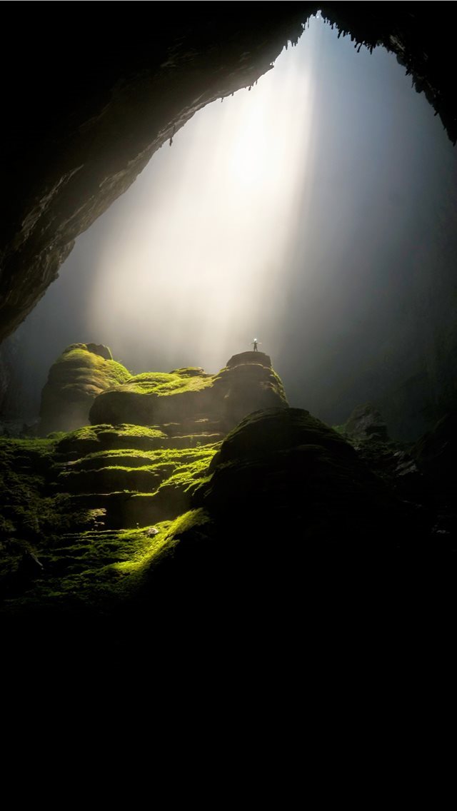 640x1136 person on top of rock formation inside cave - vietnam iPhone Wallpaper
