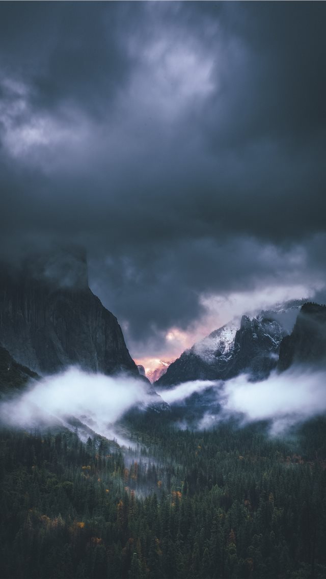 brown rocky mountain under gray sky iPhone wallpaper 