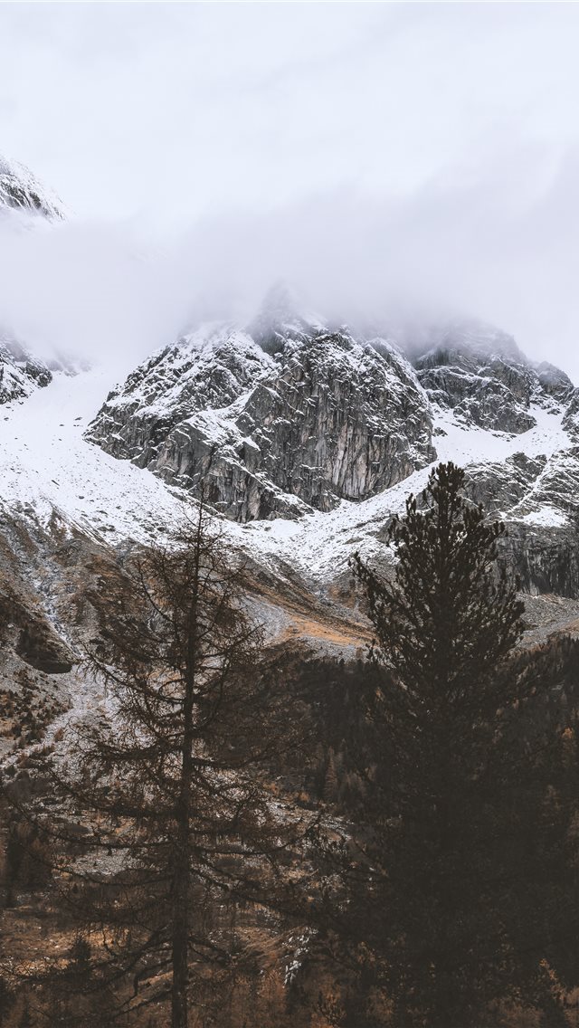 640x1136 snow capped rocky mountain under cloudy sky - tree iPhone Wallpaper