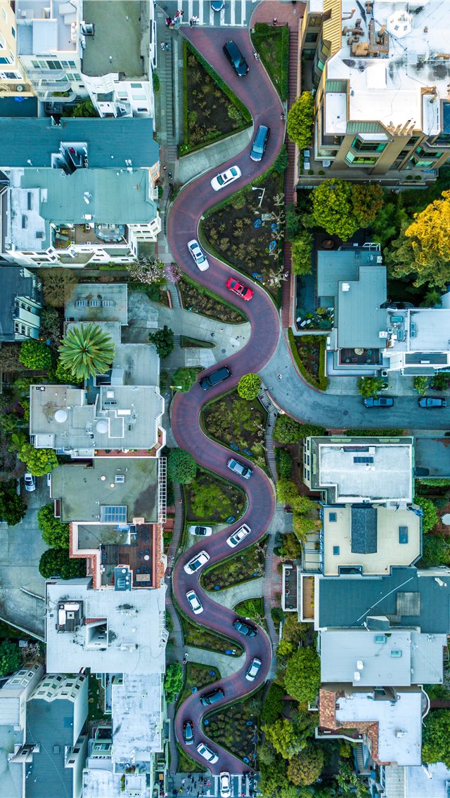 curved road during daytime iPhone wallpaper 