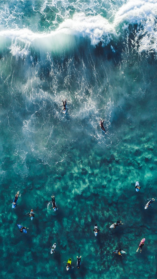 people on body of water iPhone wallpaper 